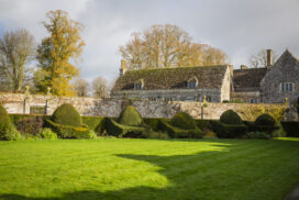 Neatly clipped topiary in the gardens in november at avebury manor, wiltshire